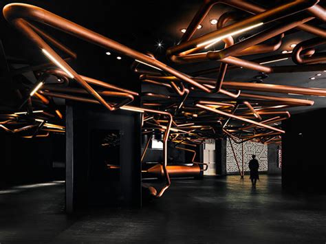 Futuristic Tangled Copper Pipes Run Throughout This Cinema Design You
