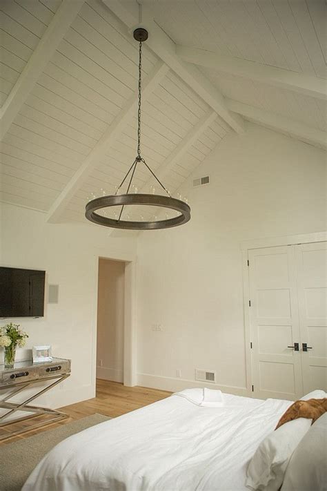 With a vaulted ceiling, look for interesting chandeliers and pendant lights for style and add recessed lighting for additional ambient illumination. Bedroom Ceiling. Bedroom Lighting. This bedroom features ...