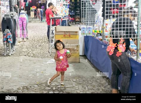 A Young Girl Enjoys Her Ice Cream At A Festival In Bucerias Nayarit