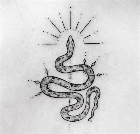 A Black And White Photo Of A Snake Tattoo