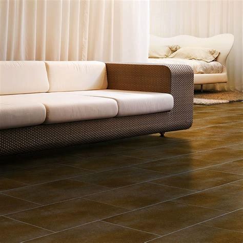 Trafficmaster laminate flooring is inexpensive and recommended for those that want to try their hand at flooring a room the easy way. TrafficMASTER Ceramica 12 in. x 24 in. Russet Brown Resilient Vinyl Tile Flooring (30 sq. ft ...