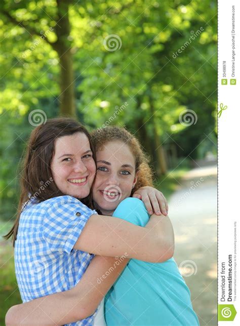 Two Young Teenage Friends Hugging Royalty Free Stock