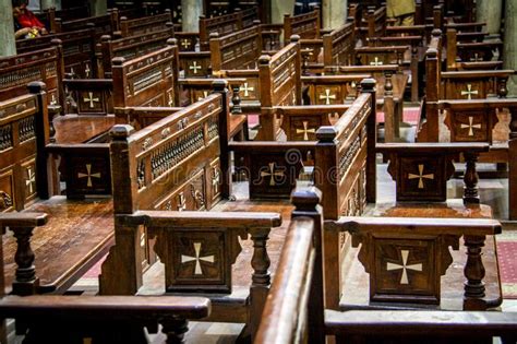 Wooden Chairs Adorned With Crosses Inside The Hanging Church In Cairo