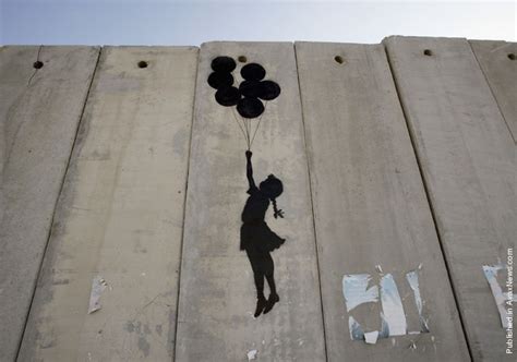One depicts a hole in the wall with an idyllic beach, while another shows a mountain landscape on the. The World of Banksy Art : Banksy Graffiti in Palestine