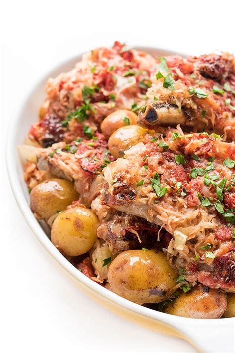 In a large baking dish with a lid, place the pork loin in the center and surround it with the potatoes. Oven Baked Pork Chops with Potatoes - The Lemon Bowl ...