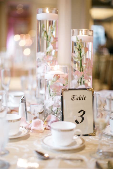 Floating Candle Centerpieces With Blush Orchids And Rose Gold Table L
