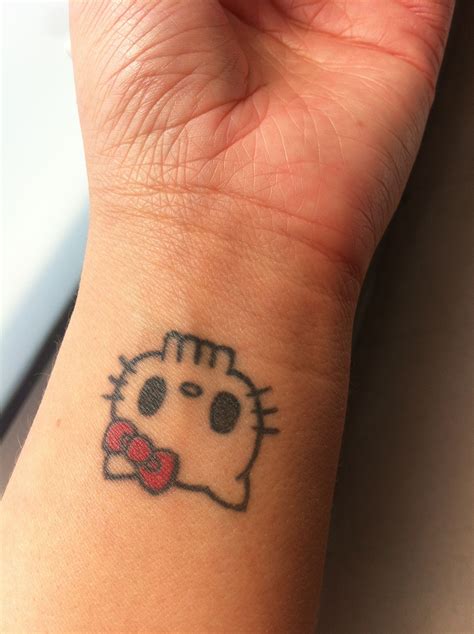 Hello Kitty Tattoo On Wrist Hello Kitty Tattoos Cute Tiny Tattoos