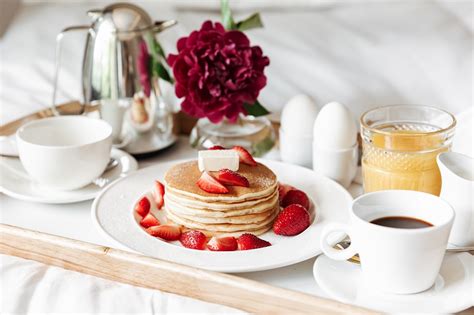 Breakfast In Bed With White Linen Pancakes Boiled Eggs Coffee Lets