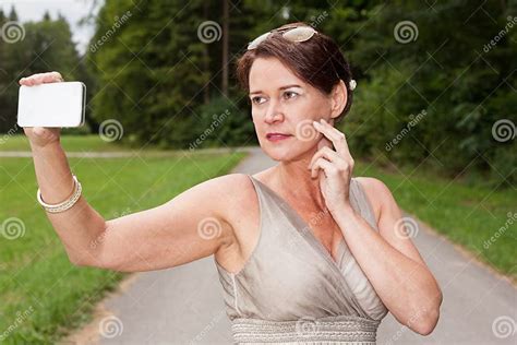 Woman In Gown Taking Self Portrait With Cell Phone Stock Image Image