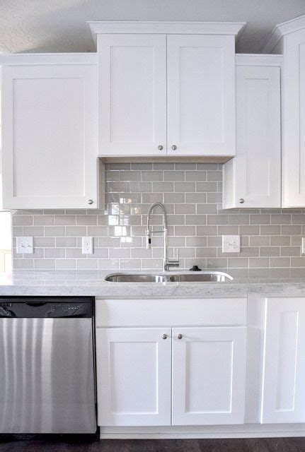 Glass tiles reflect the light in your room giving it a fresh, clean… Smoke Glass Subway Tile | White shaker cabinets, Shaker ...