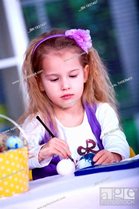 Little Girl Painting Easter Eggs Stock Photo Picture And Royalty Free