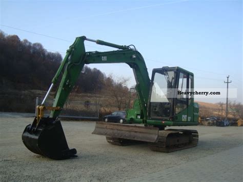 The large spacious cab provides a comfortable work area. CAT 307 1995 Mini/Kompact-digger Construction Equipment ...