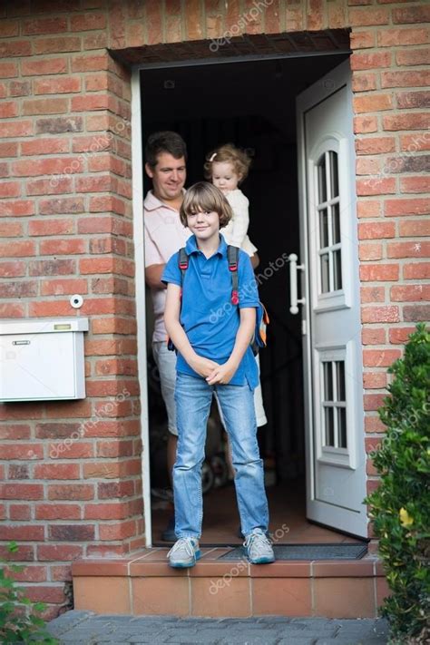 Boy Leaving Home For His First Day Back To School Stock Photo By