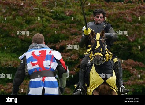 The Black Knight Charges At Thomas Of Rockingham As People Dressed As
