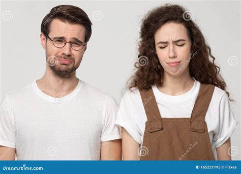 Unhappy Millennial Couple Feel Distressed Crying Indoors Stock Image