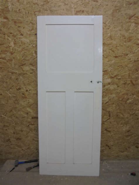 Chad mellon inspiration for a coastal bedroom remodel in los angeles with white walls light switch by do not position your bed so as to have your feet point out the door while you're sleeping; Plain White 1 over 2 Panel Door - Authentic Reclamation