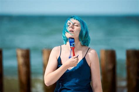 Artistic Blue Haired Woman Performance Artist In Dress Smeared With Blue Gouache Paints On Her