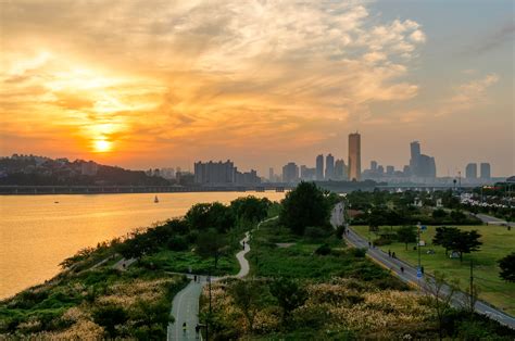 Sunset Over Han River Park With The Skyline Of Yeouido In The Distance