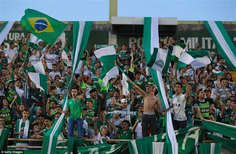 Fans cry while paying tribute to the players of brazilian team chapecoense real at the club's arena conda stadium in brazil on 3 december. Atletico Nacional fill stadium to pay tribute to ...