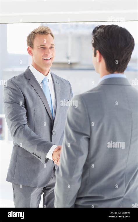 Business Colleagues Greeting Each Other Stock Photo Alamy