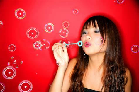 girl asian black eyes brunette bubble red background wallpaper coolwallpapers me