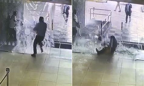 Shocking Moment Worker Runs Smack Bang Into A Glass Door In Mexico Daily Mail Online