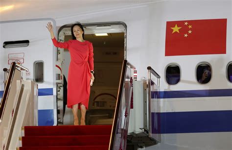 Huawei Cfo Meng Wanzhou Waves As She Steps Out Of A Charter Plane At