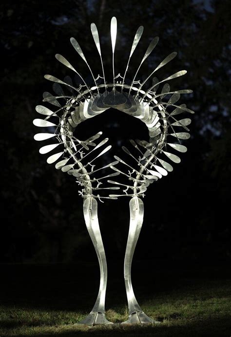 A Sculpture Made Out Of Forks In The Dark