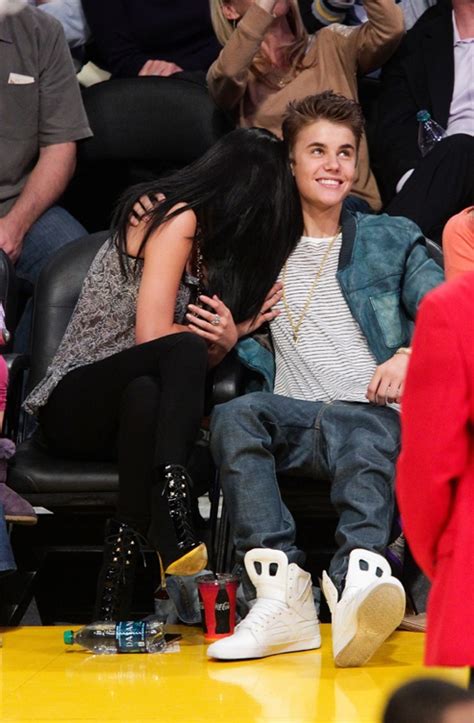 justin bieber and selena gomez spotted kissing at lakers game [photos]