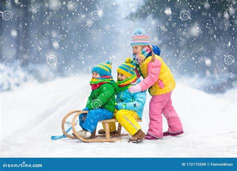 Kids Play In Snow Winter Sleigh Ride For Children Stock Photo Image
