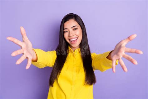 Photo Of Charming Nice Young Woman Open Hand Young Smile Wear Yellow