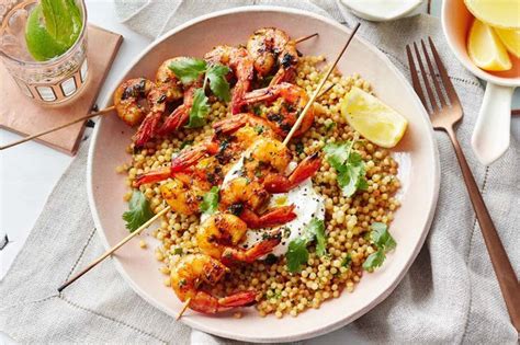Moroccan beef stew with couscous. Moroccan chermoula prawns with pearl couscous