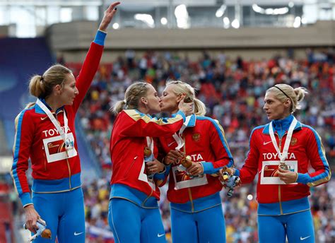 russian athletes in gay kiss photo deliver furious denial that they were protesting anti gay