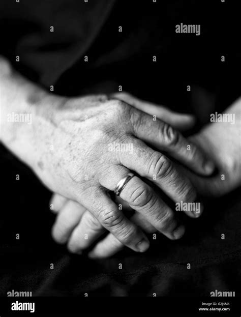 Elderly Mans Hands Resting On Lap Stock Photo Alamy