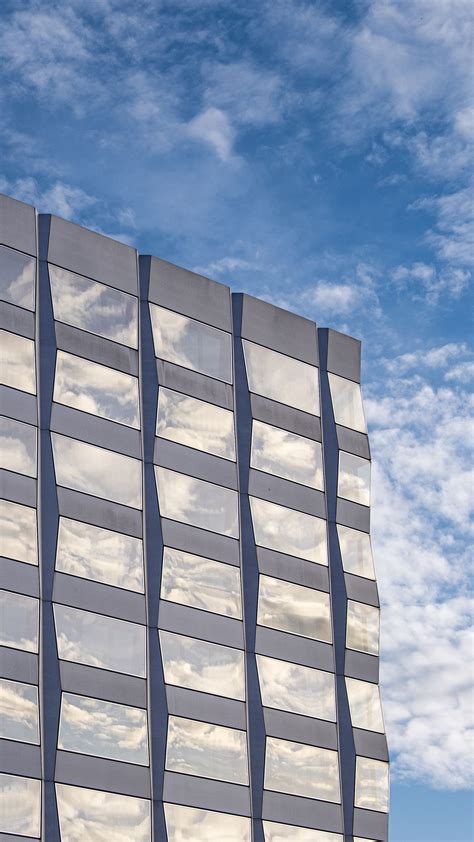 Download Wallpaper 1440x2560 Building Architecture Glass Clouds