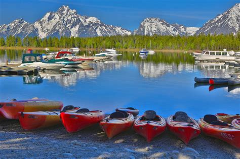 Kayaks And Boats On Colter Bay Photograph By Dan Sproul