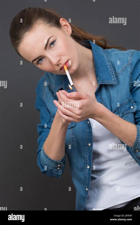 Woman Lighting Cigarette Hi Res Stock Photography And Images Alamy