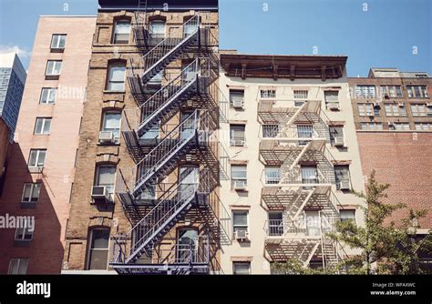 Retro Toned Picture Of Old Buildings With Fire Escapes New York City