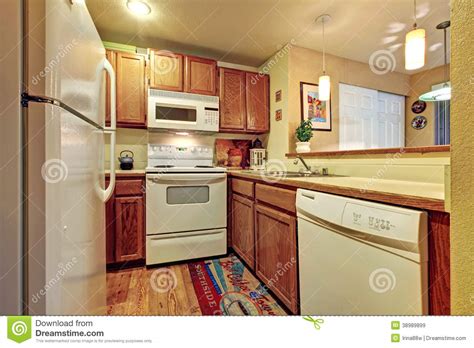 Not having to transfer everything to a different room and then bringing them back is tiring. Small Simple Kitchen Room Stock Photo - Image: 38989899