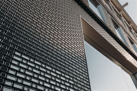 UNStudio's pixelated façade of stainless steel brick and glass captures the spirit of couture ...