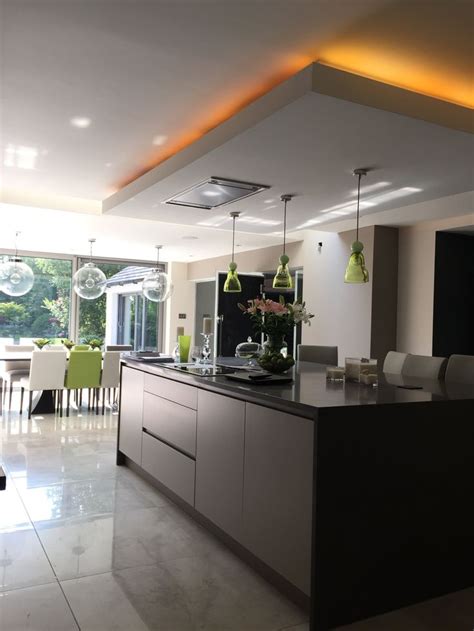 Images of lighting over kitchen islands. Annabelle Tugby Architects // Lowered ceiling over kitchen ...