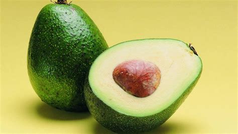 Download Green Avocado Fruit In Halves Still Shot Wallpaper