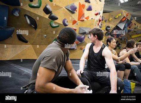 Young Male Climbers Looking At Wall In Climbing Gym Stock Photo Alamy