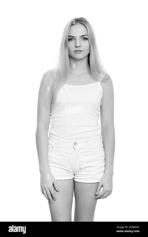 Studio Shot Of Young Beautiful Teenage Girl Standing Stock Photo Alamy