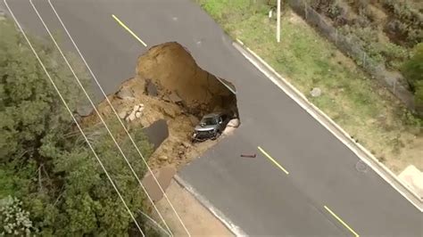 Sinkhole Swallows Cars In La Prompting Rescue Youtube