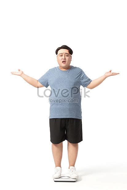 Obese Man Standing On A Weight Scale With A Puzzled Expression Picture