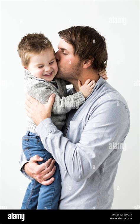 Father Kissing Son 2 3 Stock Photo Alamy