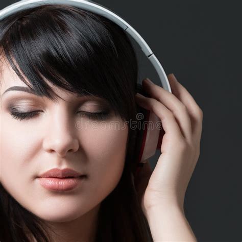 Close Up Portrait Of Young Woman Listening To Music Stock Photo Image