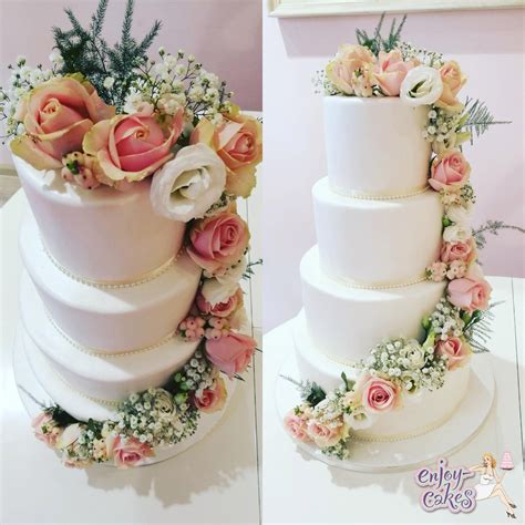 White carnations stand for pure love and good luck. White wedding cake with real flowers - Enjoy-Cakes