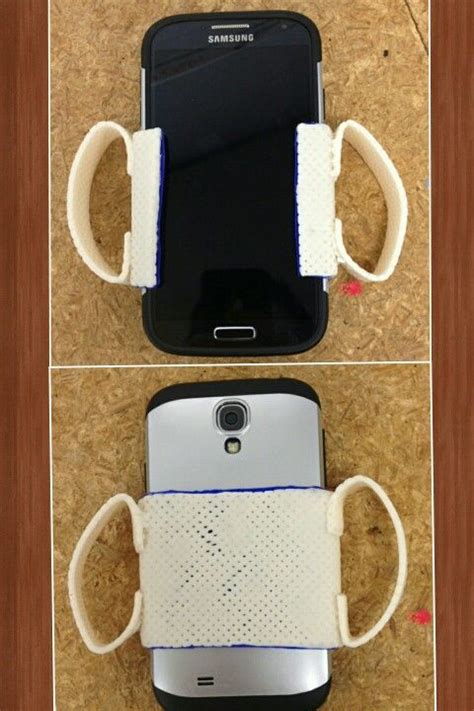 Adaptive Phone Holder Using A Perforated Splint With A Blue Dyson